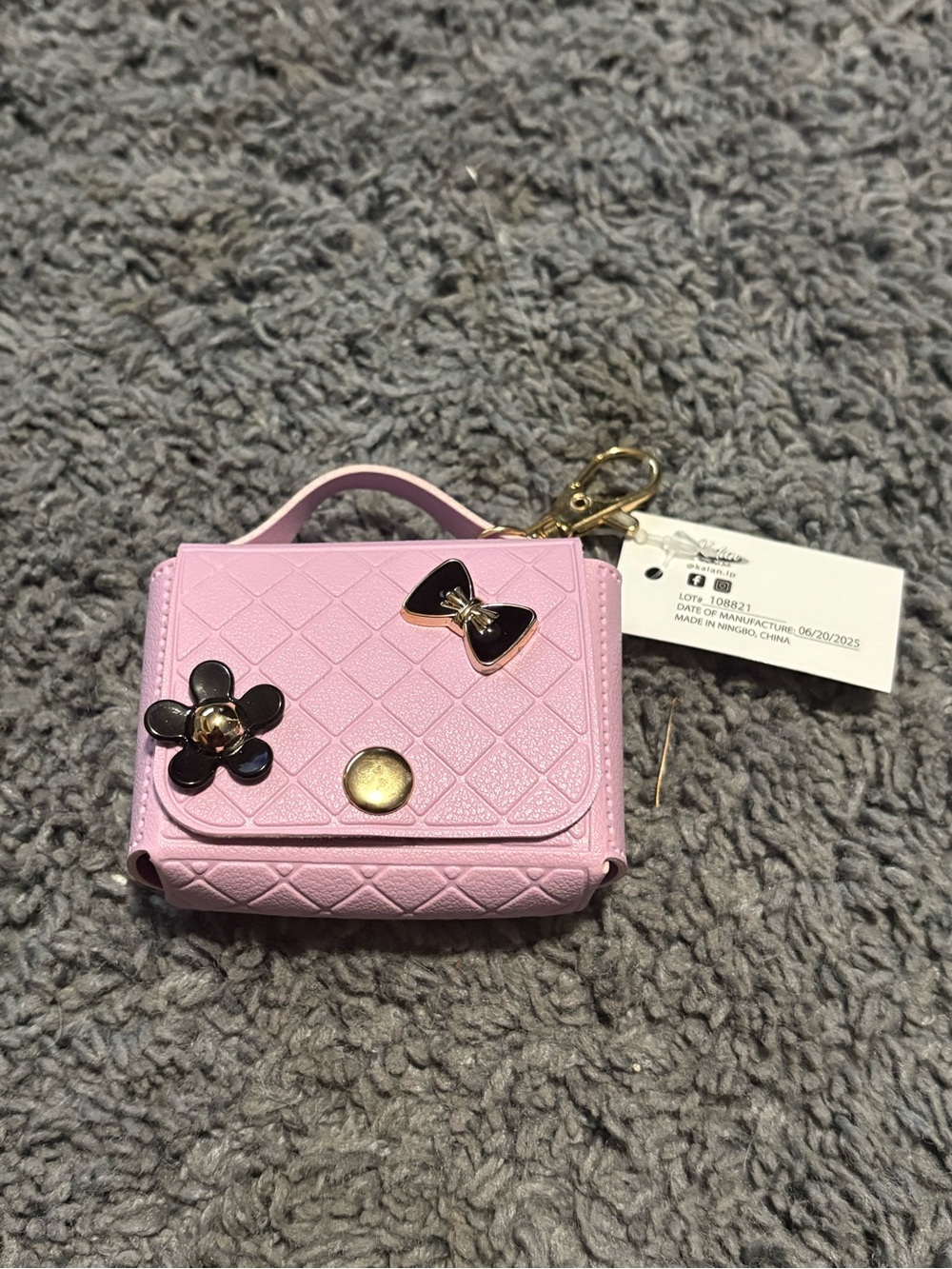 NWT small purple purse pouch keychain
with black bow and flower as decor